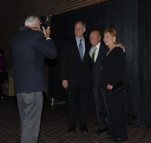 Al Large, left, a Hall of Fame Committee member, takes a picture of Steve Luecke with Mike and Karen Leep. Large also put together the slide show that was displayed during the social hour and dinner. SBAA member Richard Feingold assisted him with the photography at the banquet.
